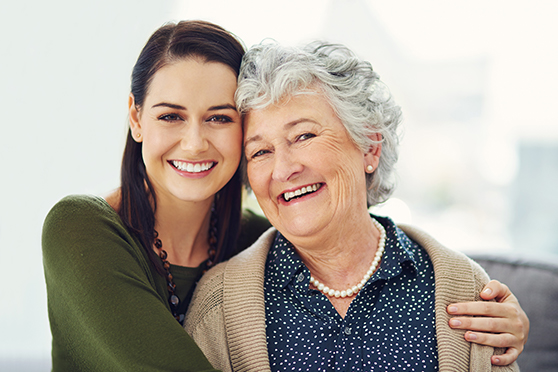 Mother and elderly mother smiling